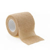 Roll of beige self-adhesive sports bandages for medical or athletic use