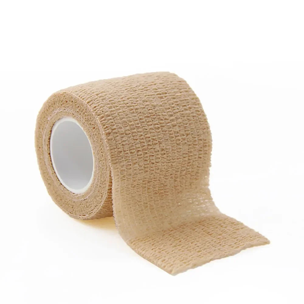 Roll of beige self-adhesive sports bandages for medical or athletic use