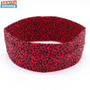 A red leopard print sports headband worn on a white background.