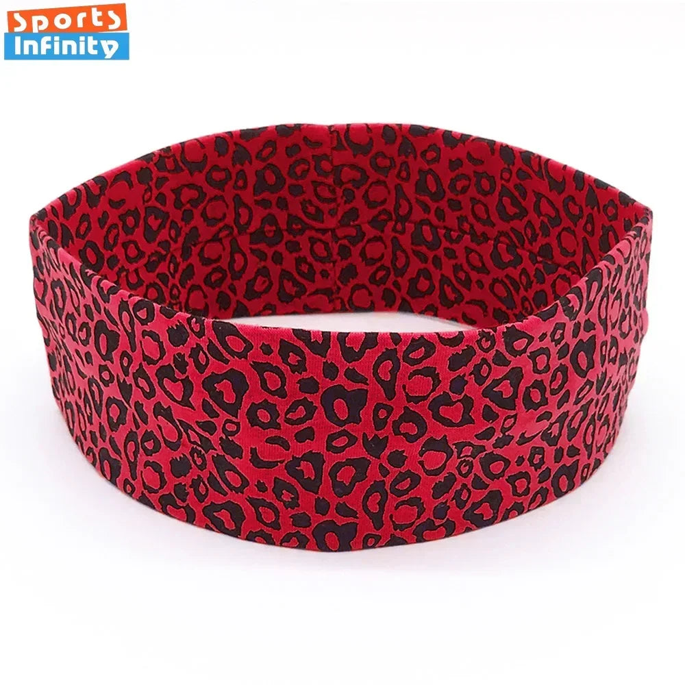 A red leopard print sports headband worn on a white background.