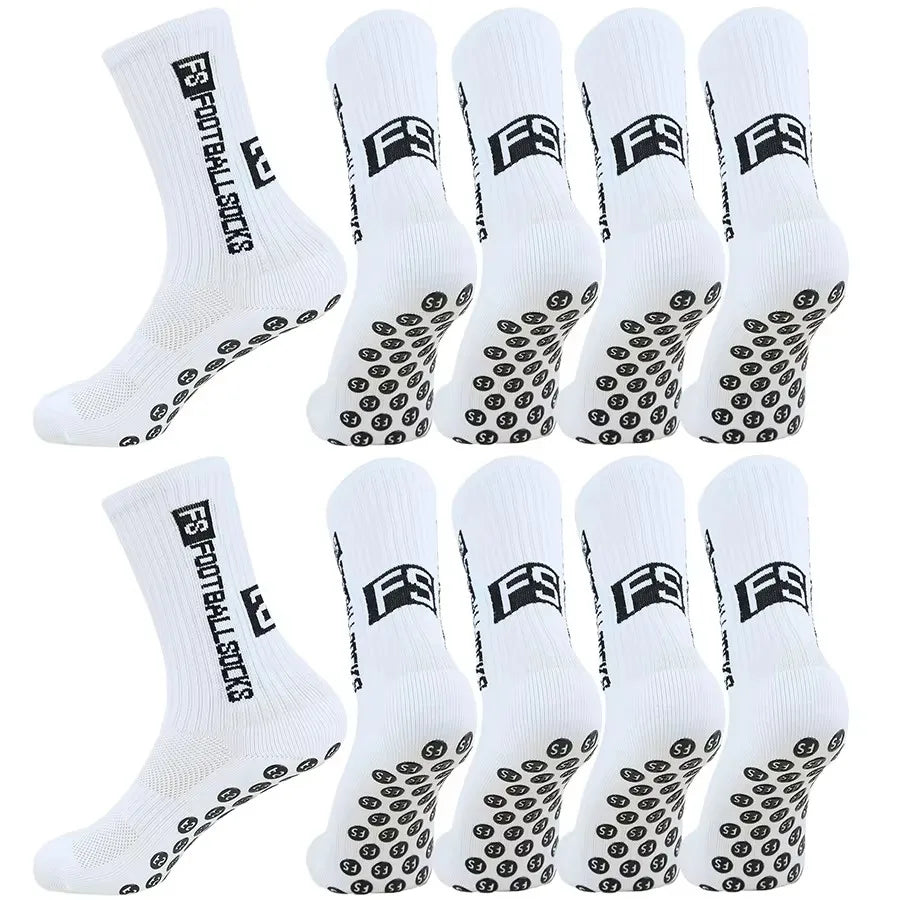 A set of white football socks with black anti-slip silicone grip patterns.