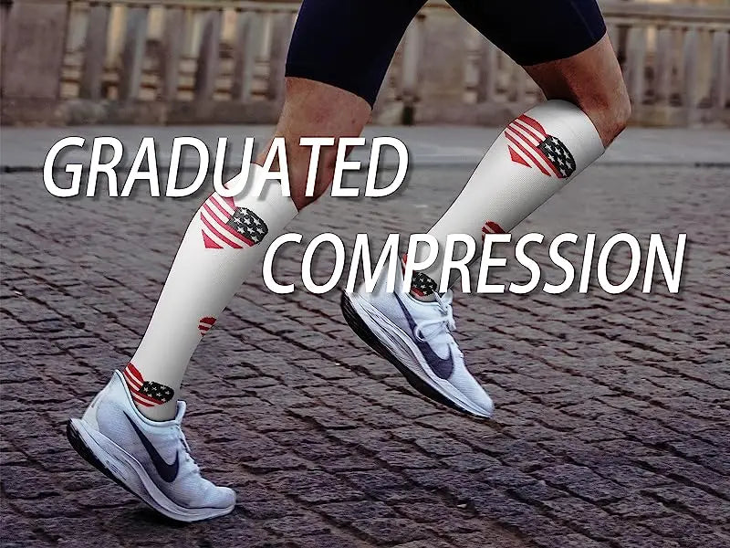 A person wearing white compression socks with American flag designs and gray sneakers is shown in a side view.