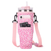 Pink leopard print adjustable pouch for carrying a water bottle with a straw and phone.
