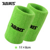 A pair of bright lime green silicone wristbands for sport or activewear