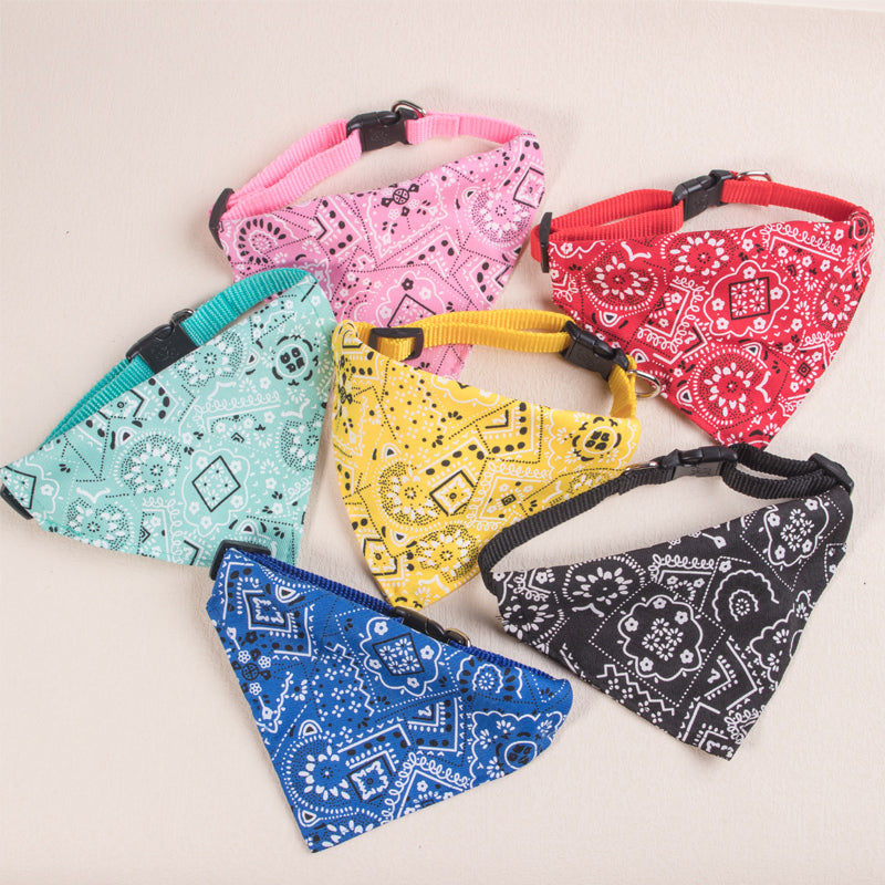 A collection of colorful, patterned adjustable pet scarves for dogs and kittens.