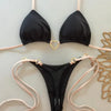 Black halter bikini set with thin pink straps displayed against a light background.