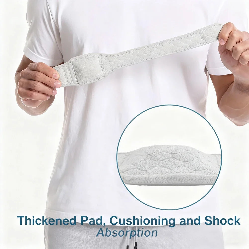 A hand is holding a light gray, padded elastic strap designed for cushioning and shock absorption.