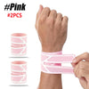 Pink dual wrist support braces shown on a hand and packaged in two pieces