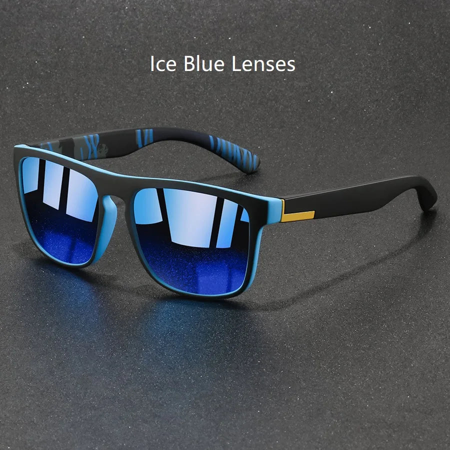 A pair of black sunglasses with ice blue lenses and a patterned design resting on a dark surface.