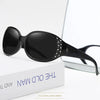 Black diamond-inlaid polarized sunglasses displayed on a white box.