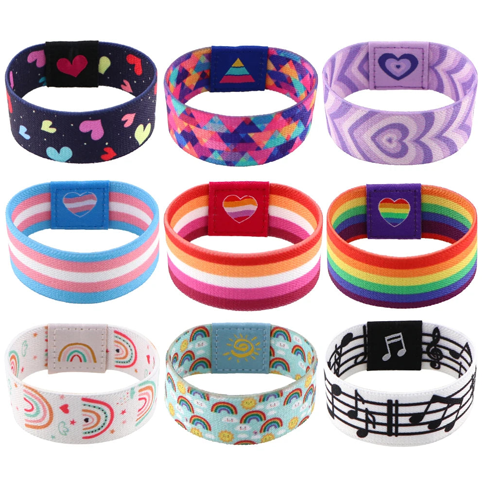 A collection of colorful LGBT stretch wristband bracelets featuring various patterns and colors.