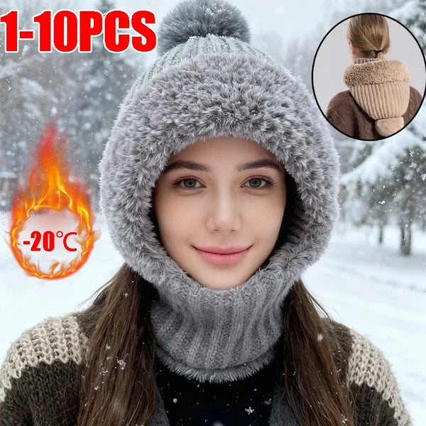 A woman wearing a gray knitted thermal fleece beanie with windproof ear covers in a snowy outdoor setting.