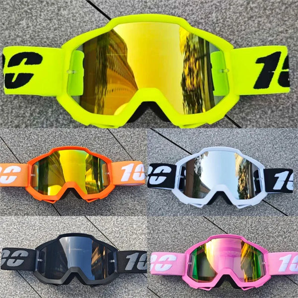 A collection of various colored off-road motorcycle and ATV goggles displayed on a gray background.