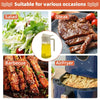 Glass oil sprayer bottle next to food items like salad, steak, and barbecue skewers.