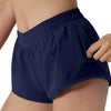 Navy women's high-waisted running shorts worn by a model.