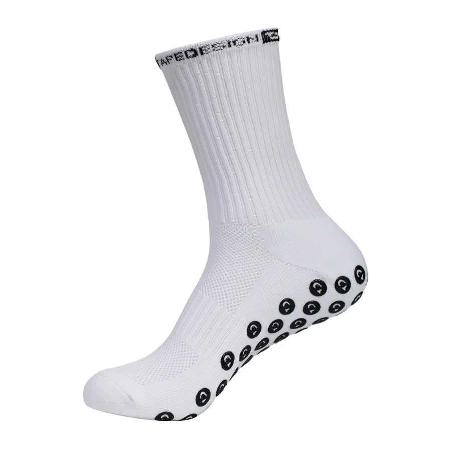 White performance sports gripping socks with black circular grips on the toe area.
