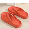 A pair of bright coral platform flip flops shown on a light background.