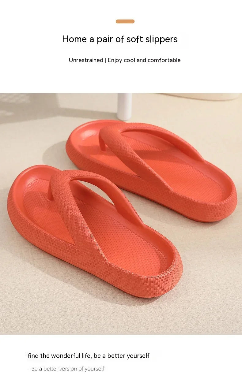 A pair of bright coral platform flip flops shown on a light background.