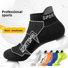 A pack of black sports socks with mesh detailing shown from the side.