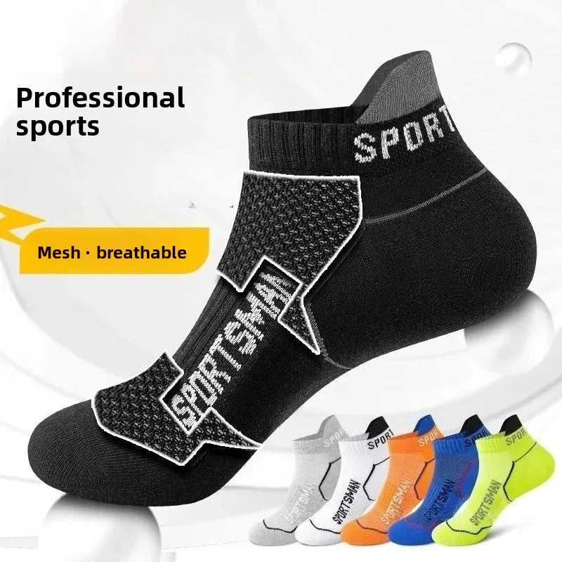 A pack of black sports socks with mesh detailing shown from the side.