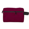 A deep magenta waterproof cosmetic and travel pouch with a black zipper and strap.
