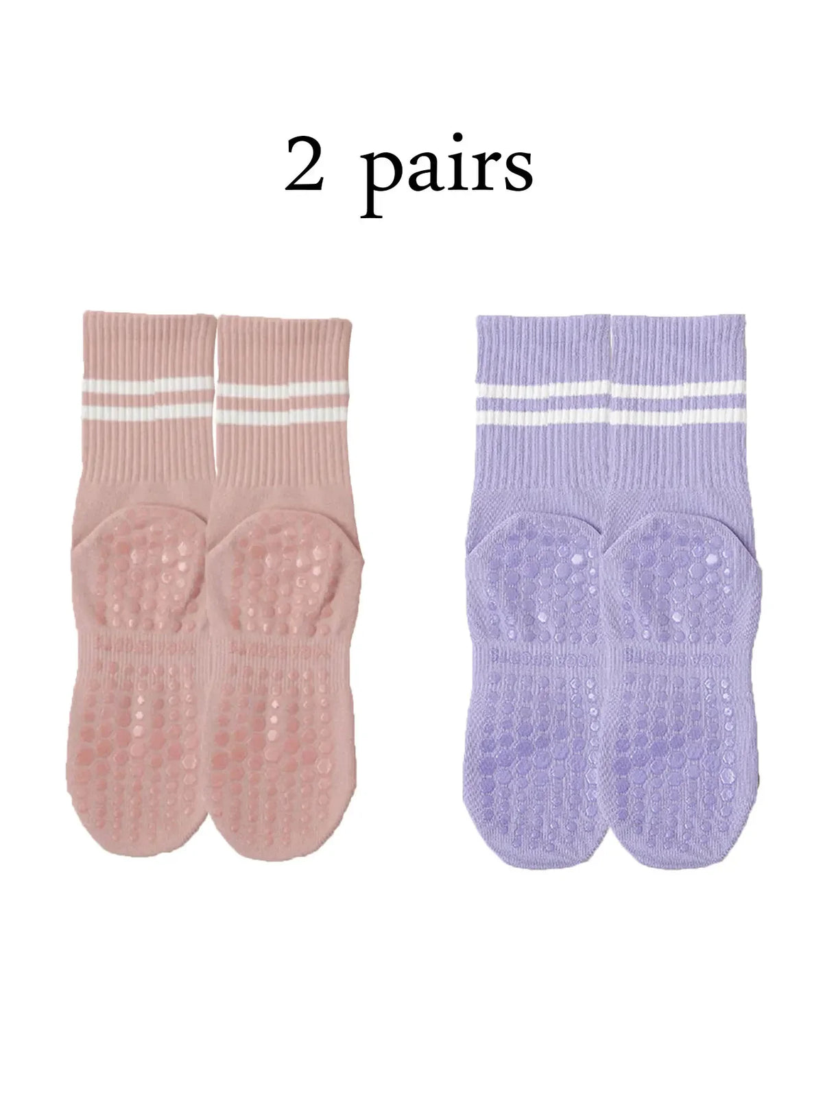 Two pairs of pink and purple grip socks for yoga and barre