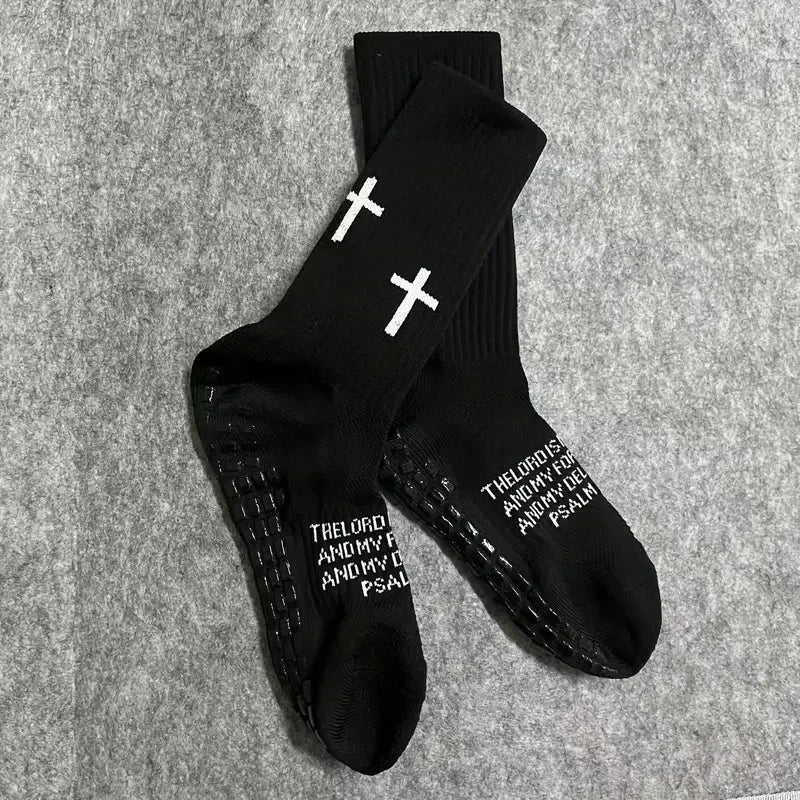 Black athletic socks with white crosses printed on the foot