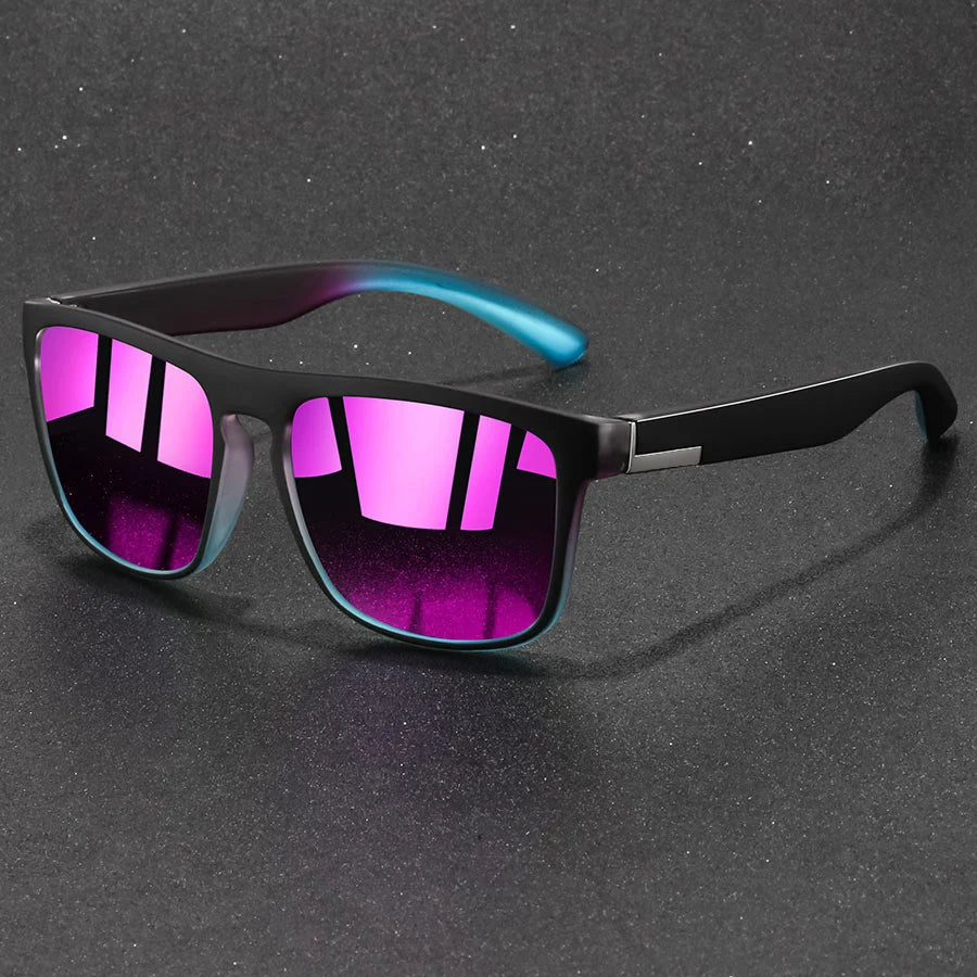 A pair of vintage designer square sunglasses with purple and blue gradient lenses resting on a dark surface.