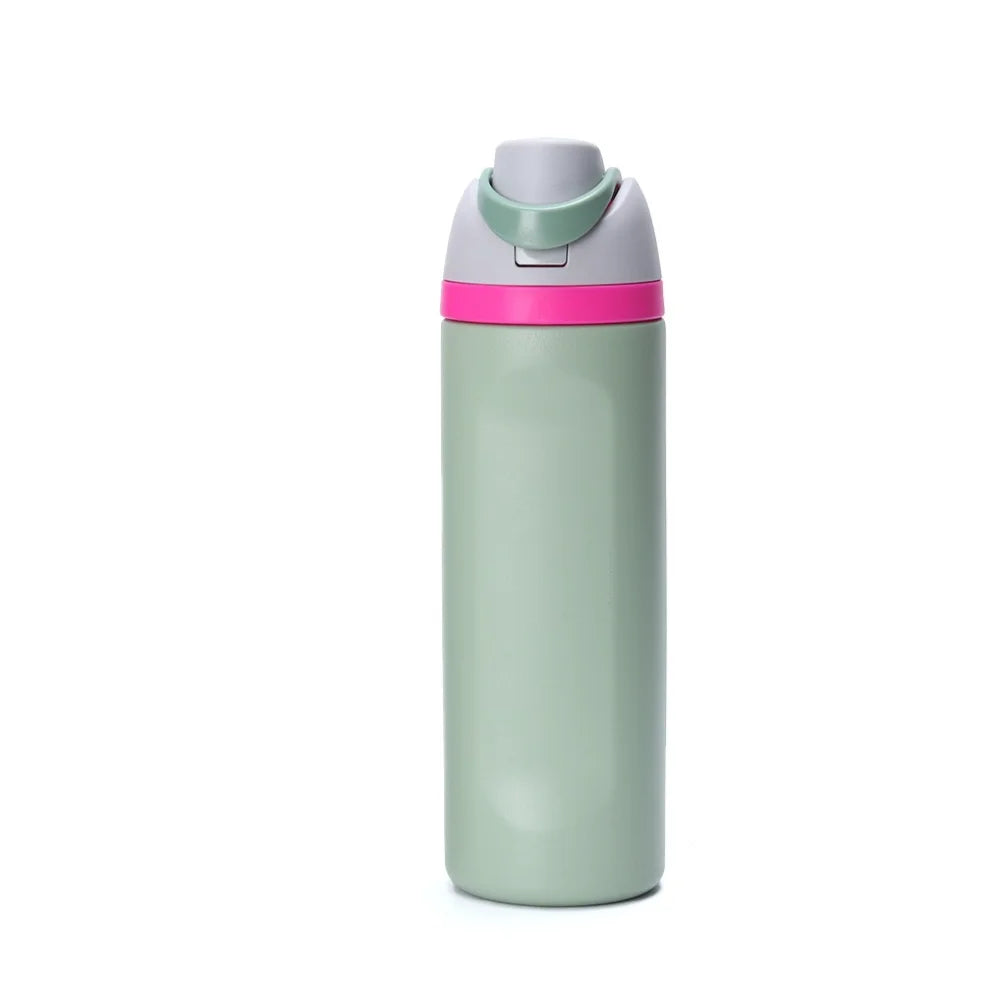 A light green insulated stainless steel thermos mug with a pink lid and straw.