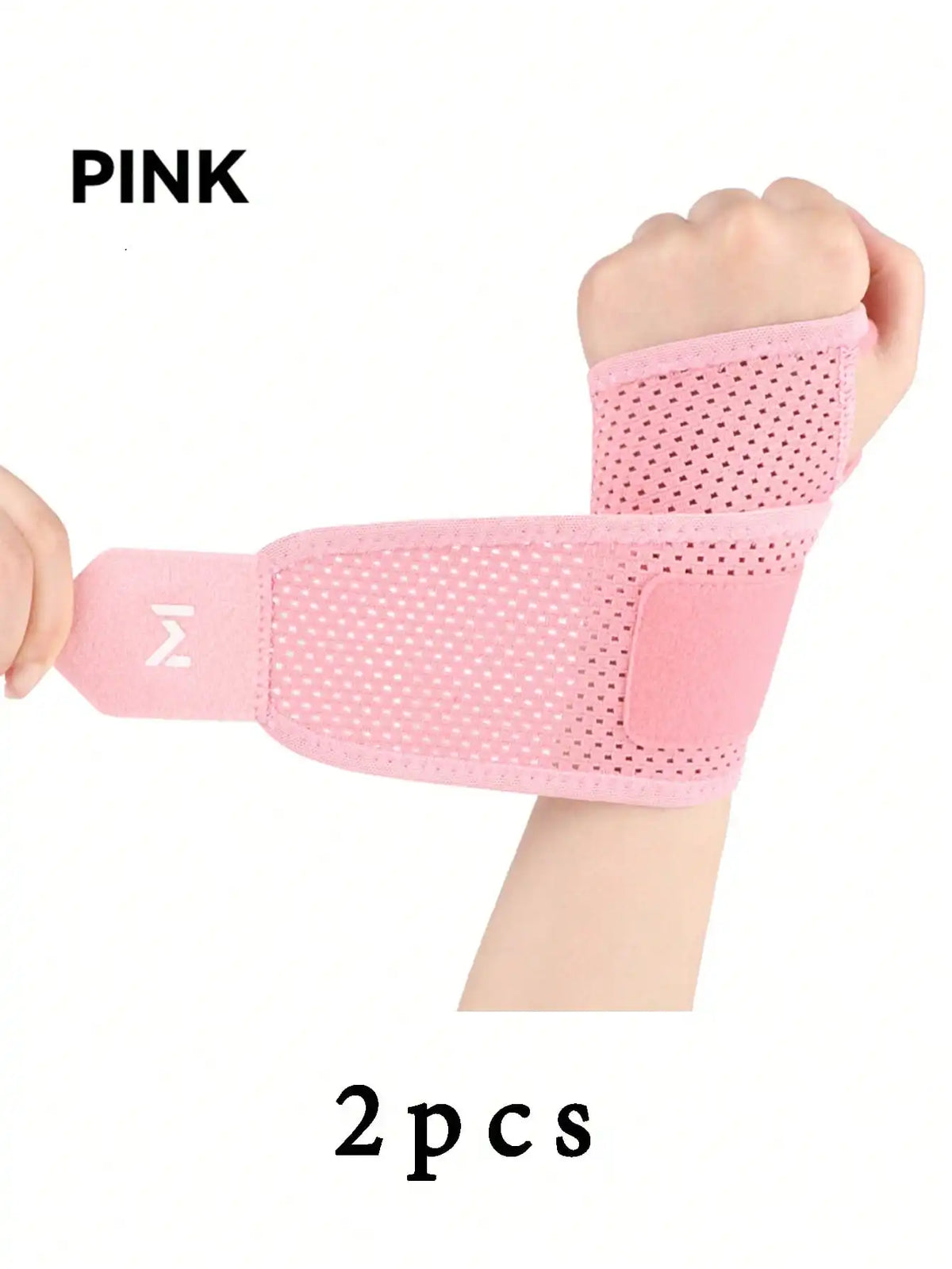 Pink adjustable wrist support brace for fitness shown on a hand.