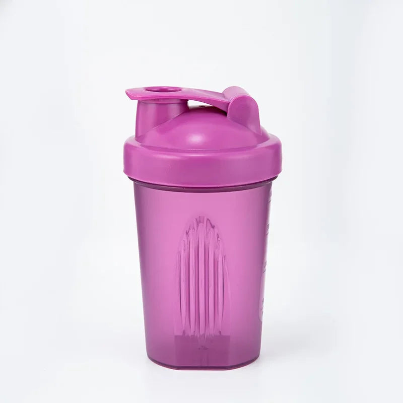 A purple leakproof protein shaker bottle with a hinged lid is shown against a white background.
