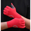 A close-up of a red cycling glove with silicone palm pads being worn on a hand against a black shirt.