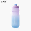A light purple and blue squeezable cycling water bottle.