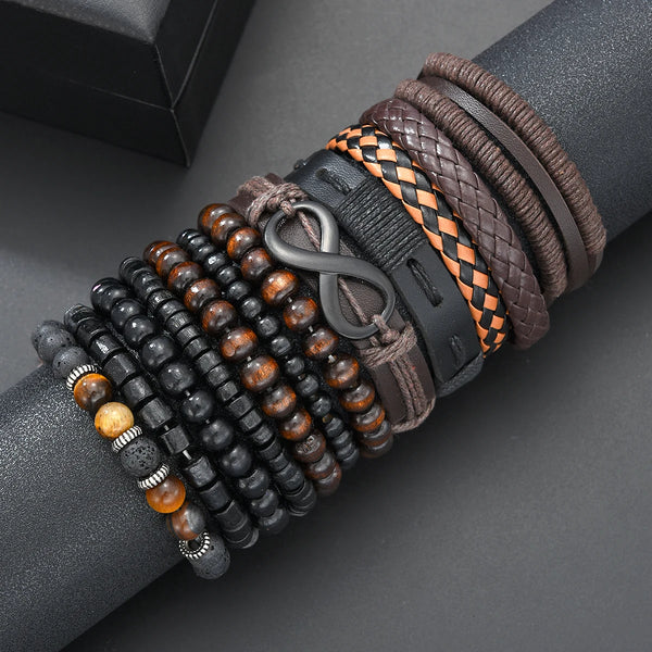 A close-up of various brown, black, and orange beaded leather bracelets stacked on a dark gray wrist.