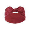A maroon fabric headband tied in a bow with a bunny ear design.