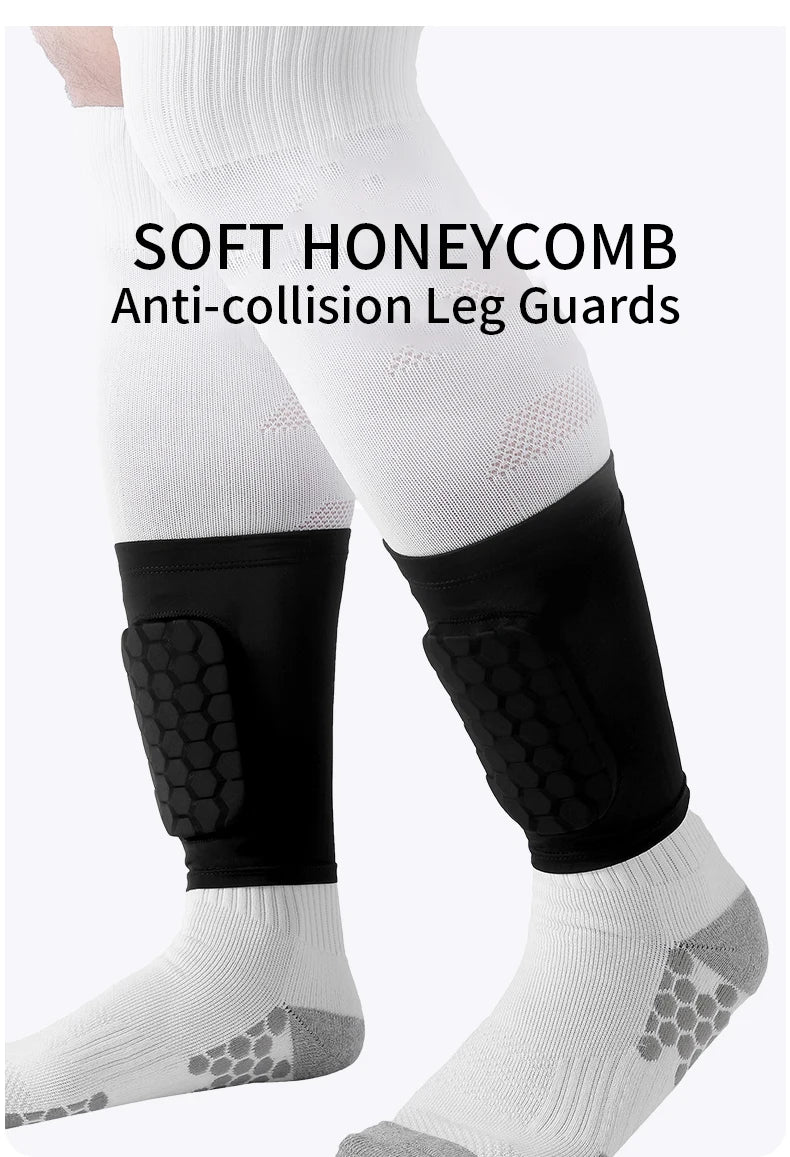 Black honeycomb anti-collision leg guards worn on a white sock and leg.