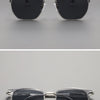 A pair of black sunglasses with silver metal frames shown against a gray background.