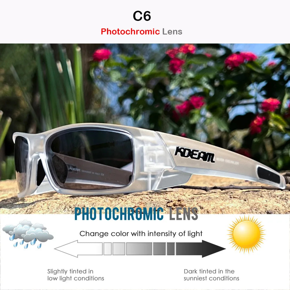 Clear plastic photochromic lens sunglasses resting on a textured surface with blurred greenery in the background.