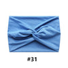 Light blue boho wide turban headband folded and displayed on a white background.