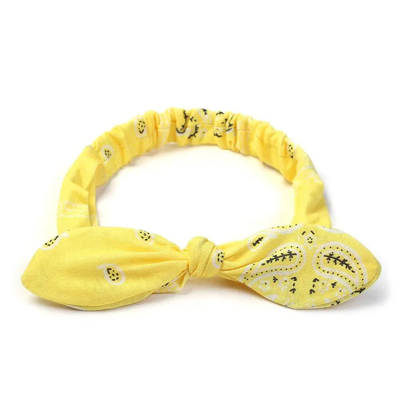 Yellow boho paisley elastic hair headbands tied in a bow