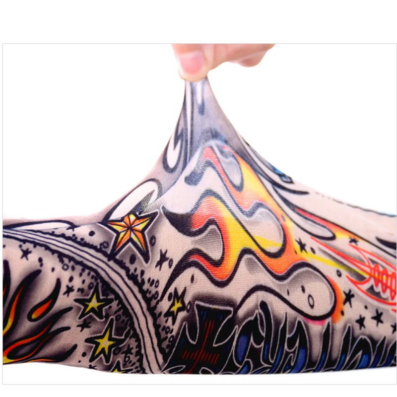 Close-up of a black and gray arm warmer featuring colorful flame and star designs.