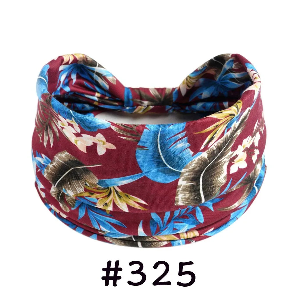 A maroon and blue floral patterned cotton headband tied in a knot for yoga or workout.
