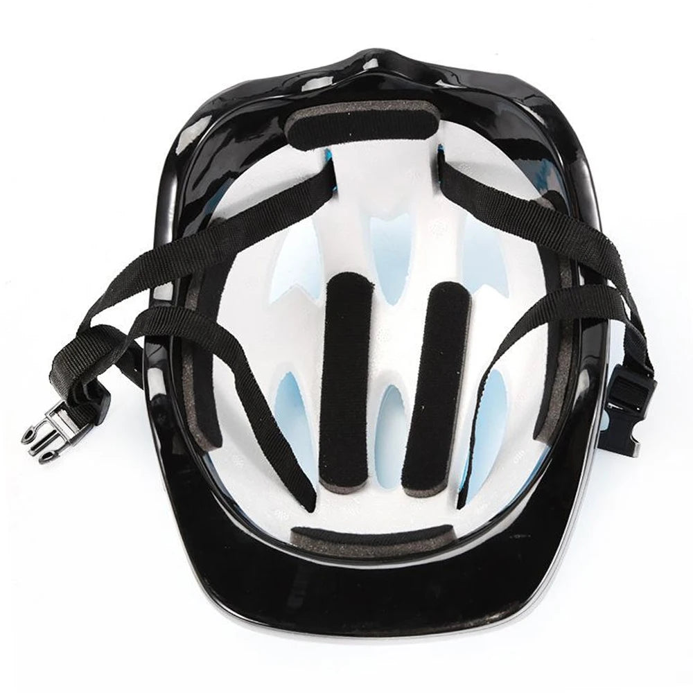 Black protective gear set for kids including a helmet, knee pads, and wrist guards