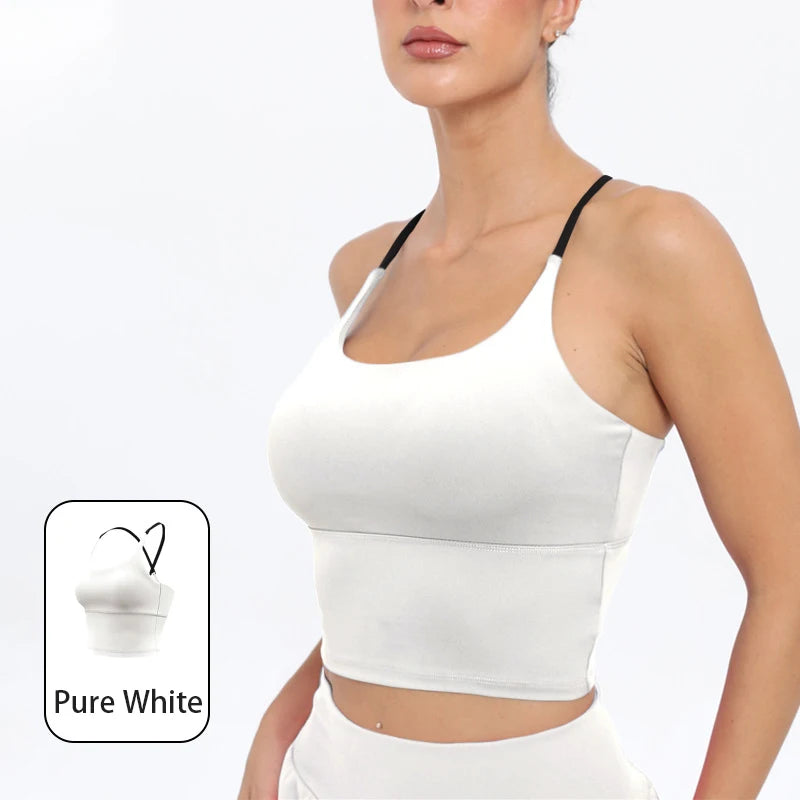 A model wearing a white summer strappy yoga sports bra with built-in padding.