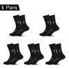 Five pairs of black performance athletic socks for sports and fitness