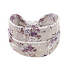 A light pink floral butterfly headband with purple and white flowers.