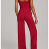 A woman models a red high-waist yoga and fitness tracksuit set featuring a long-sleeved top and matching pants.