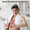 A woman wearing a black sport headband and white towel, holding a water bottle.