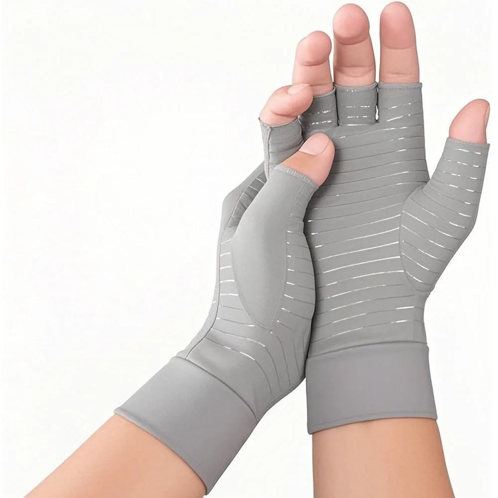Gray compression gloves for joint support worn on a hand and wrist.