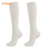 A pair of white high-compression knee-high stockings for circulation and comfort.